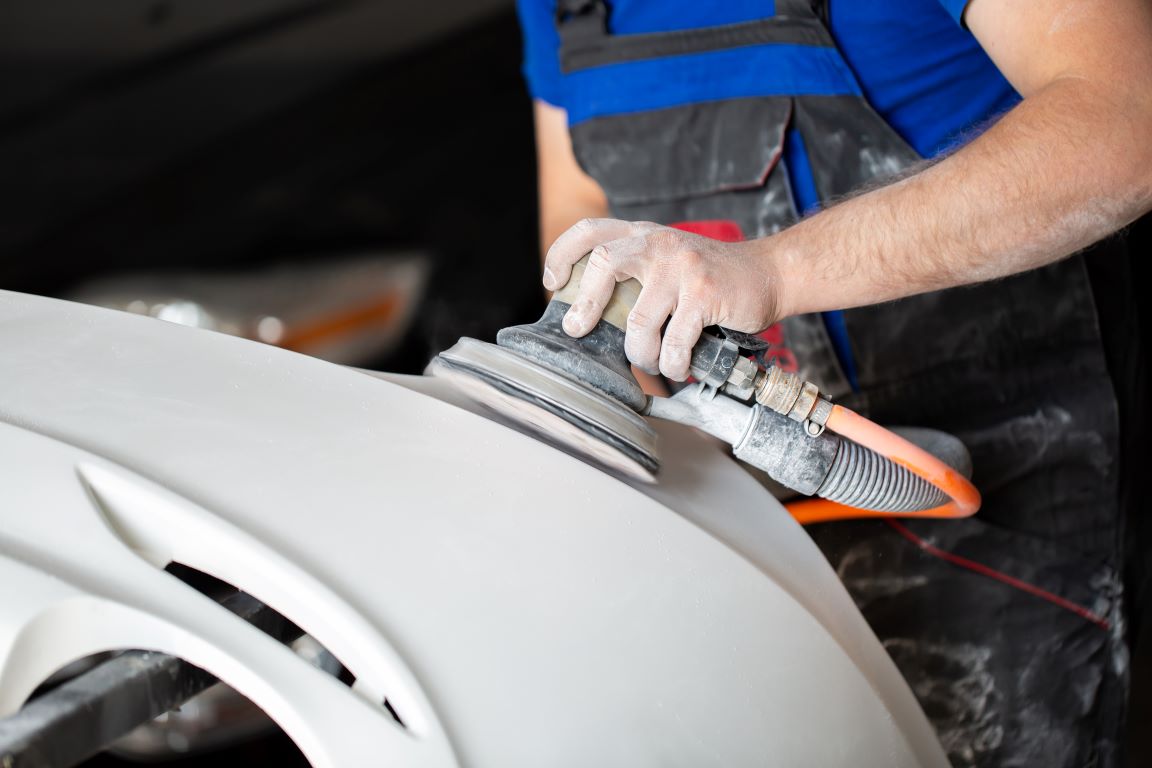 a-man-who-sanding-with-a-grinder-and-prepares-the-2024-08-08-07-05-52-utc